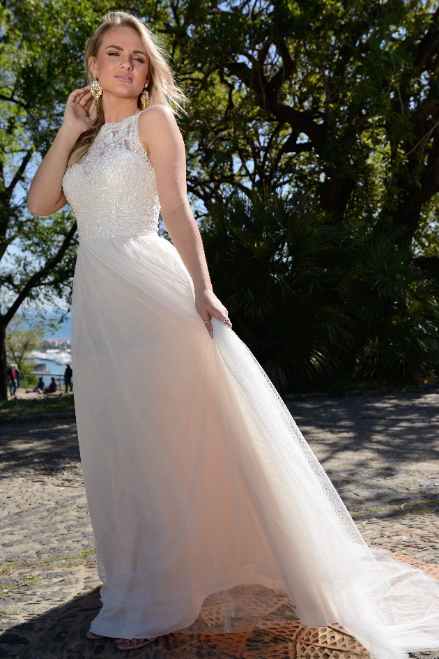 Bride holds out Catherine Parry Bridal gown