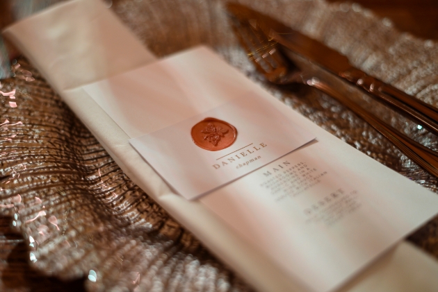 rose gold charger with wedding breakfast menu