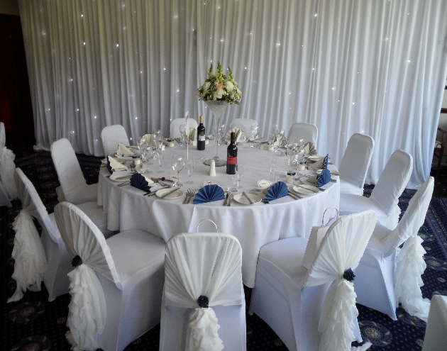 Wedding reception layout at Haydock Park Golf Club with white and navy theme