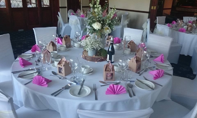 Wedding reception layout at Haydock Park Golf Club with rustic and pink theme