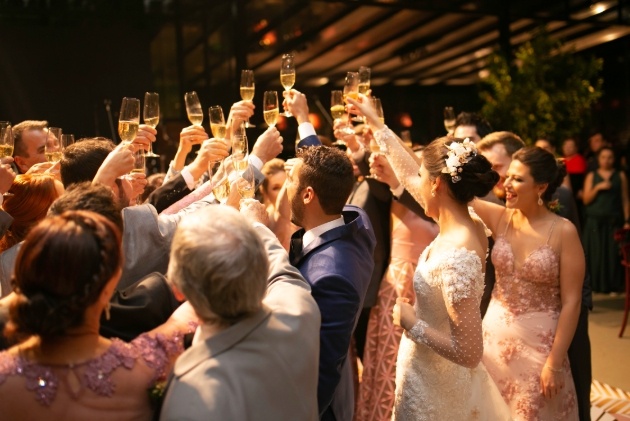 wedding party raising their glasses