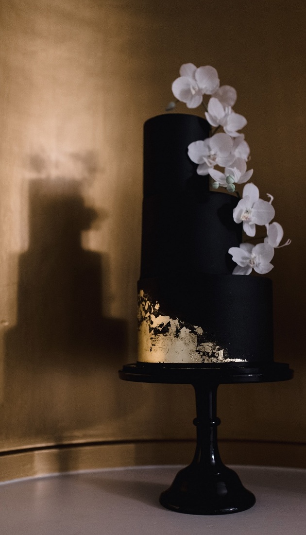 Black and gold iced orchid wedding cake