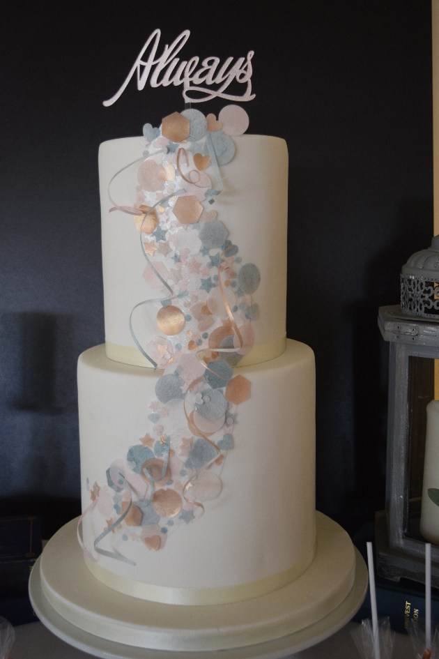 Wedding cake with blue and pink wafer paper decoration and Always topper