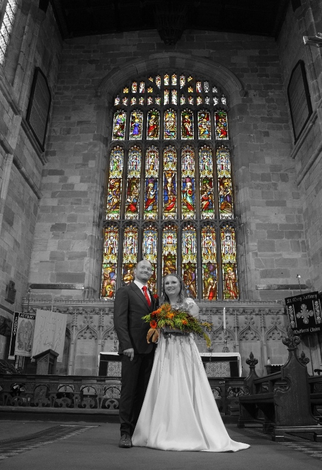 colour spot image of bride and groom in church