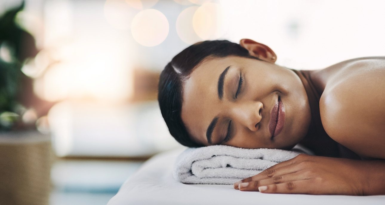 woman enjoying a relaxing massage at a spa