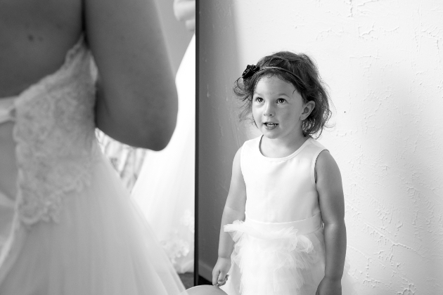 Flowergirl looking stunned at the beautiful bride