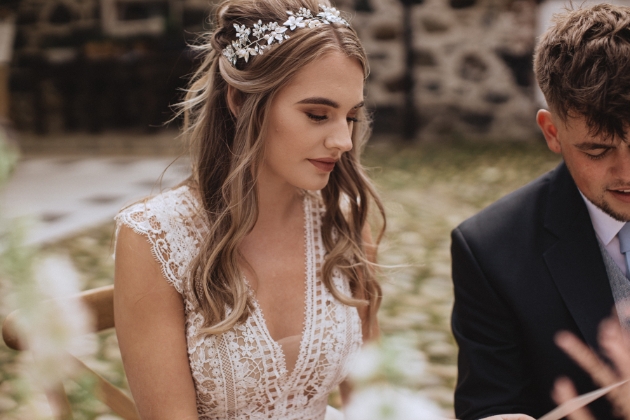 Bride wearing her hair half up and half down as a boho bride look