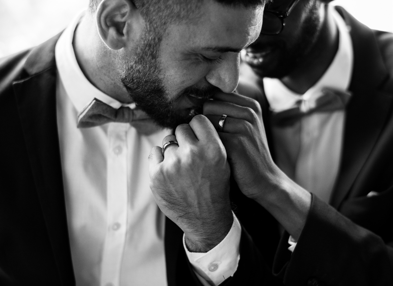 couple in suits holding hands