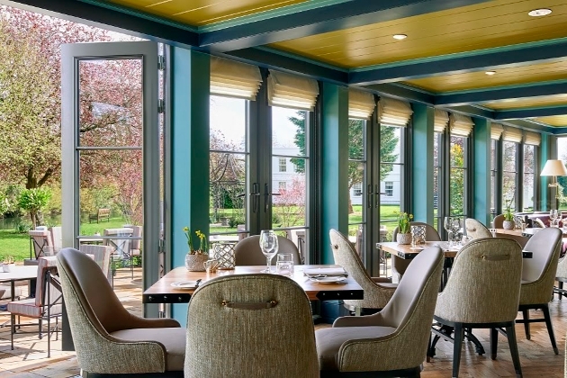 restaurant of hotel with floor to ceiling windows and bi fold doors 