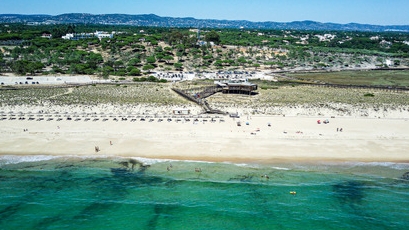 birds eye view on restaurant on the beach with the sea