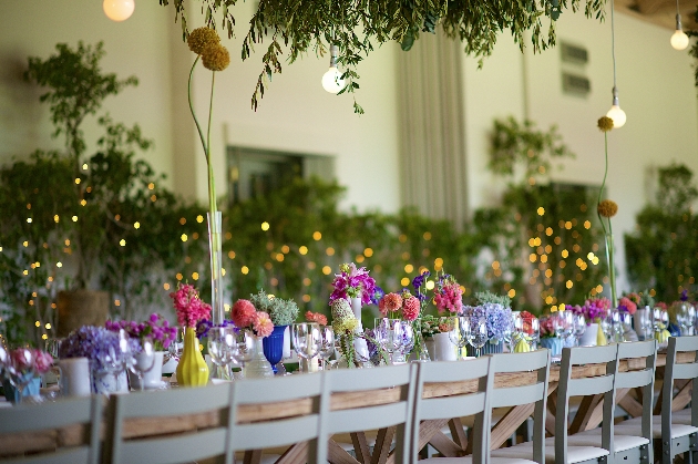 Colourful centrepieces on table at wedding