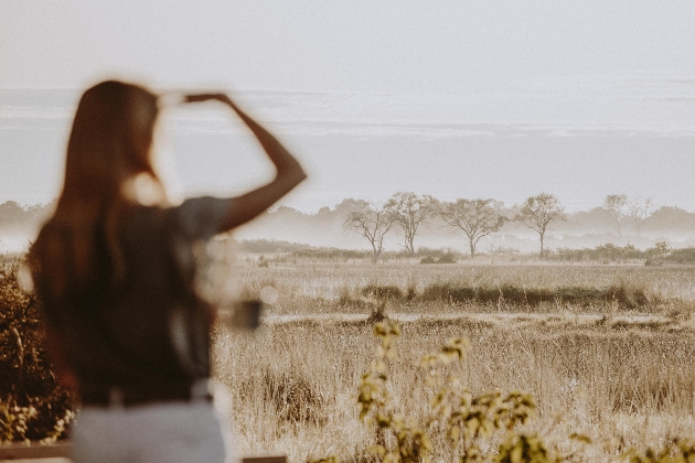 woman looking out over safari