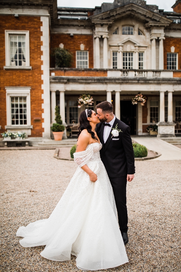 Bride and groom in front of Eaves Hall