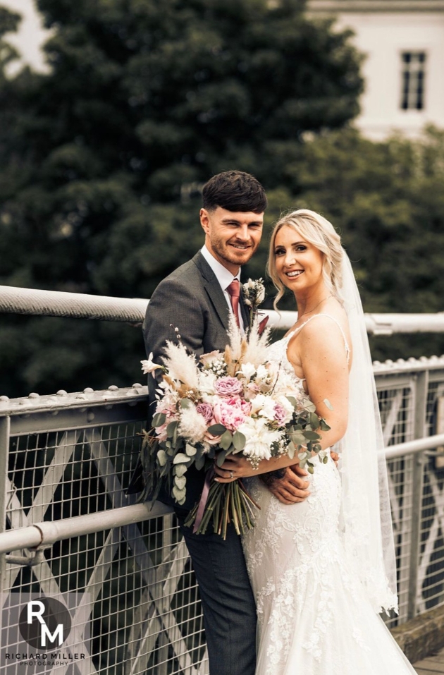 Couple posing on their wedding day