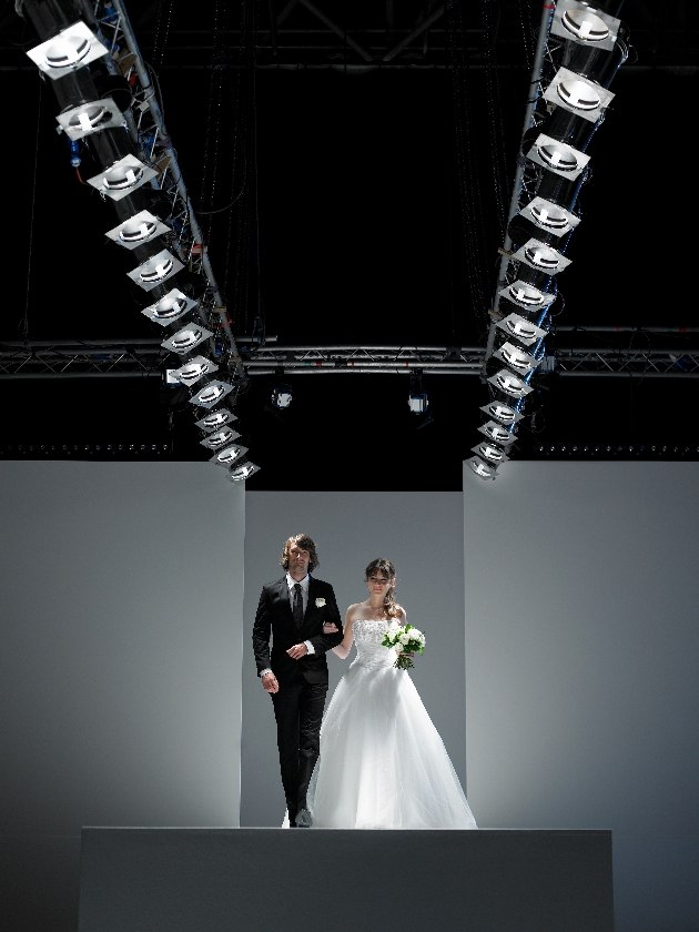 Bride and groom on a fashion catwalk