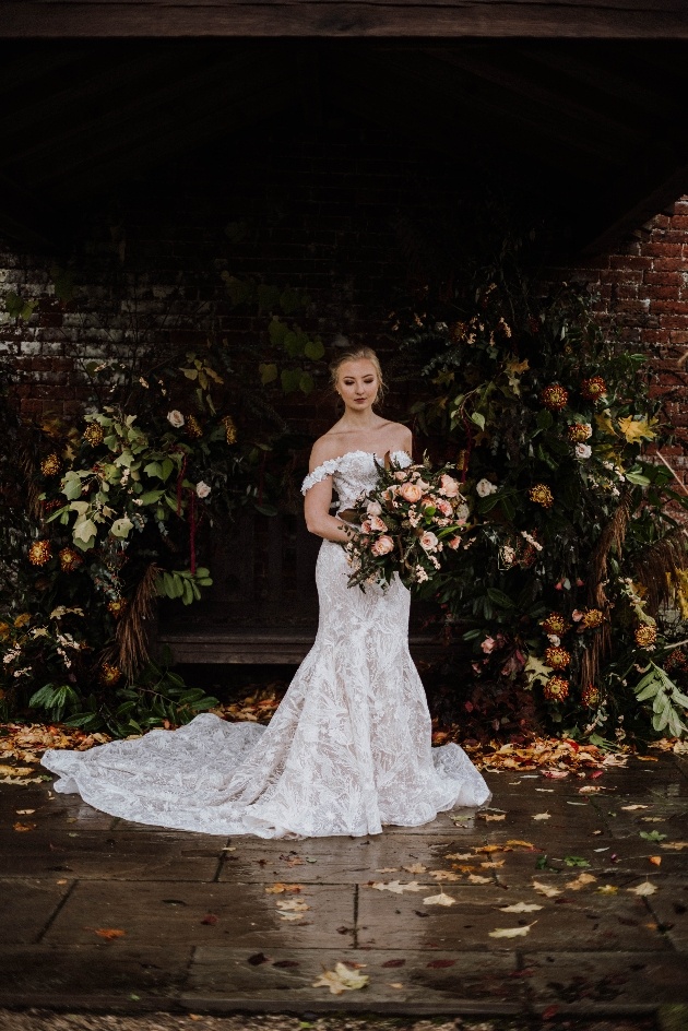 Bride posing with a bouquet of flowers