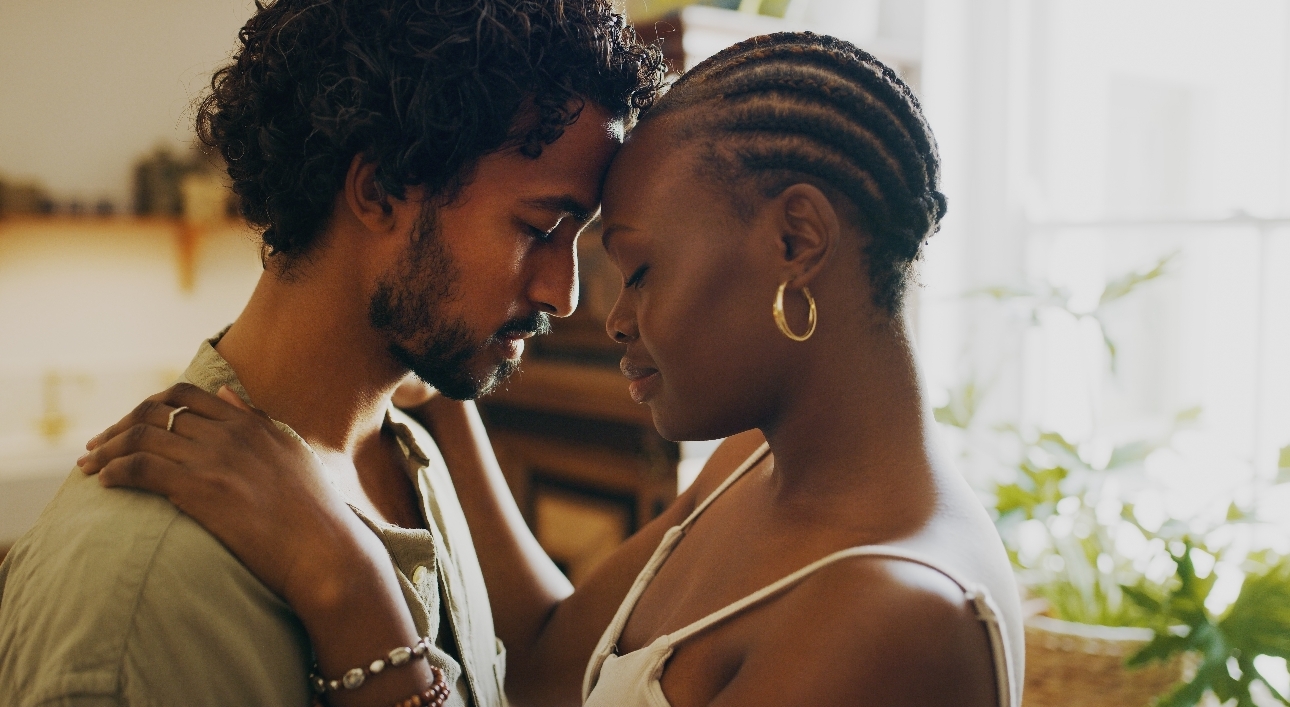 couple embracing forehead to forehead