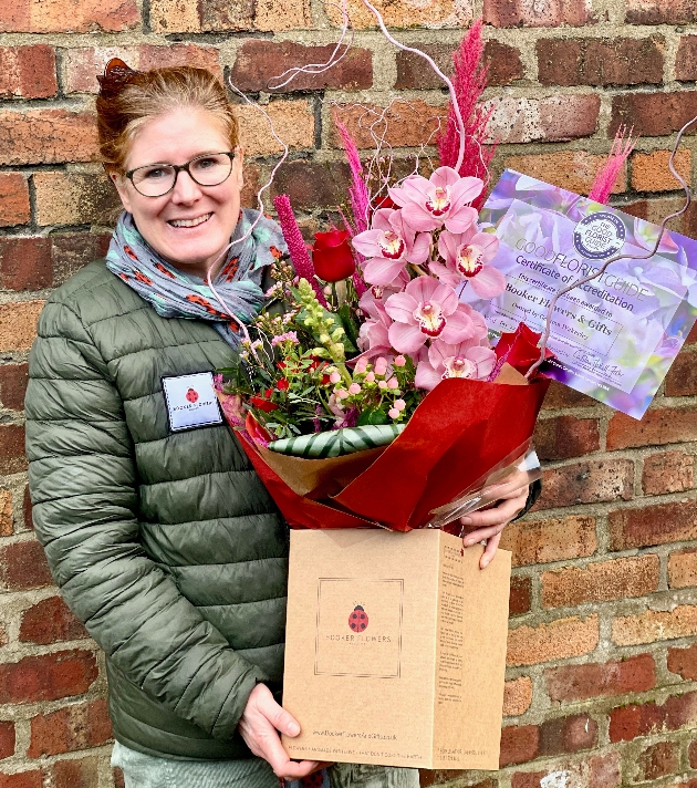 Gemma Wakerley from booker flowers & gifts holding her award