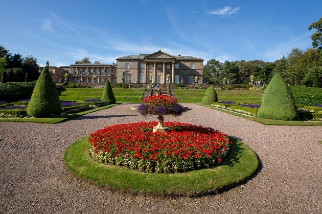 Exteror of Tatton Park with red flower bed in the foreground