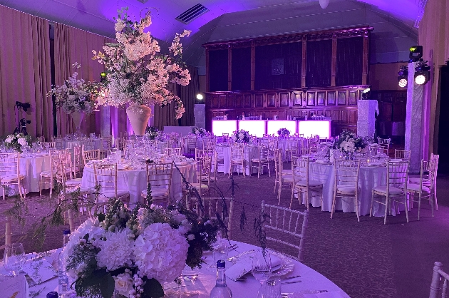 Interior of Tatton Park set up for a wedding with purple uplighting