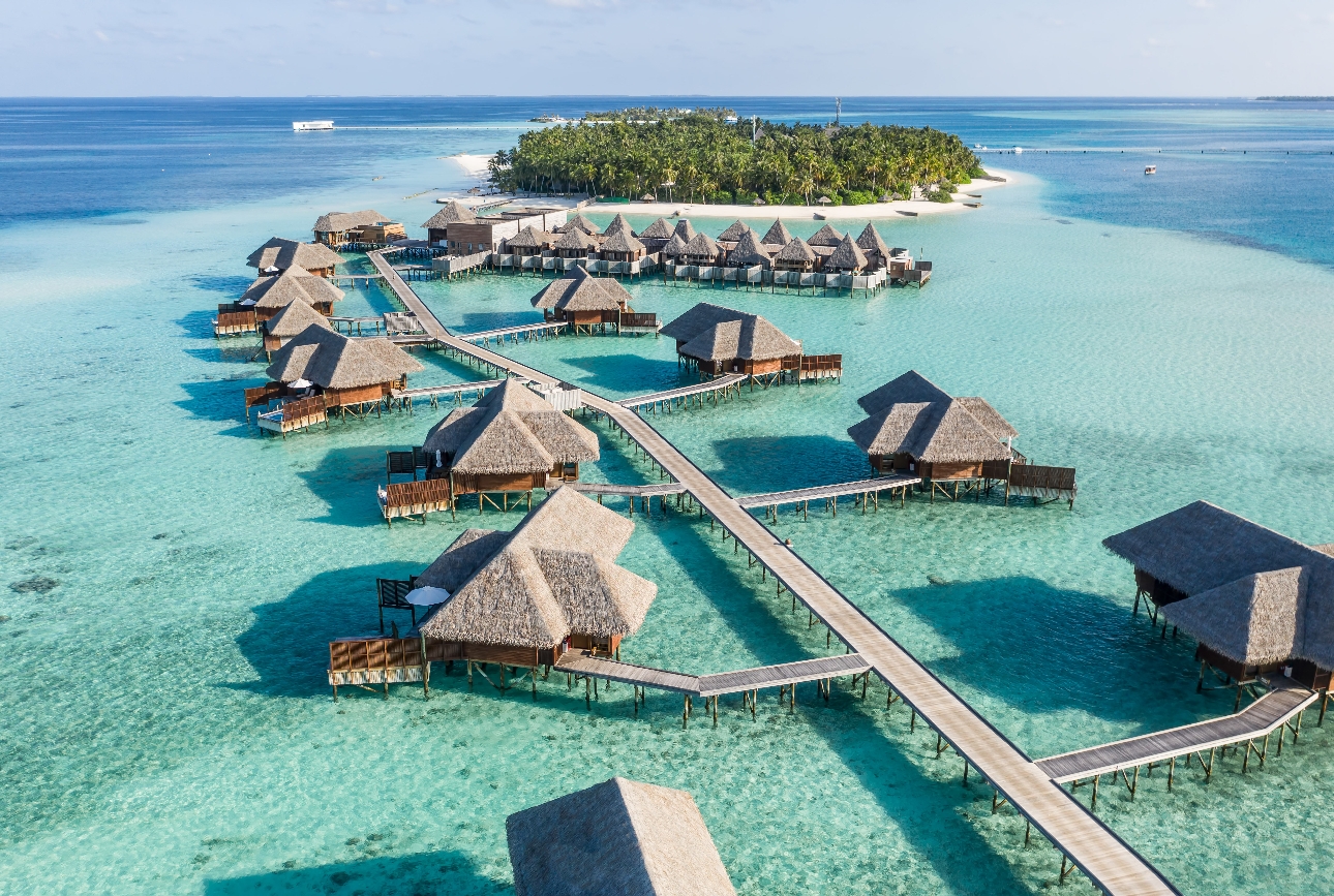 panoramic view of island with water bungalows