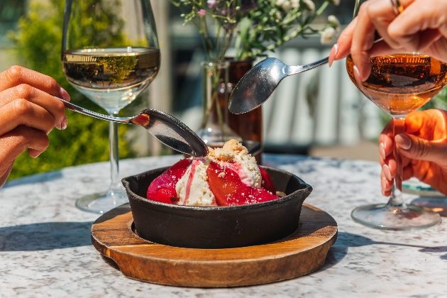 Two people sharing a dessert at The Botanist