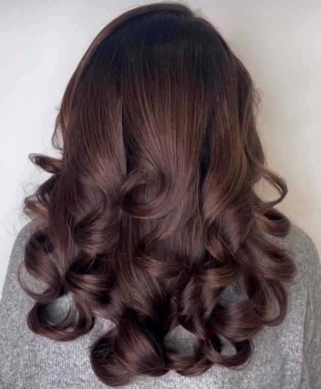 Beautiful high shine brunette long hair curly seen from back