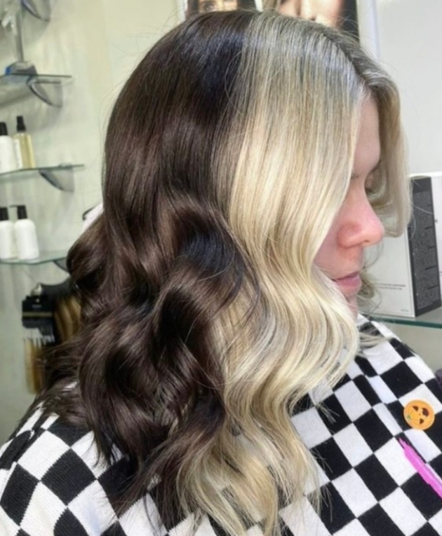 side view of long wavvy hair blonde at the front brunette at back