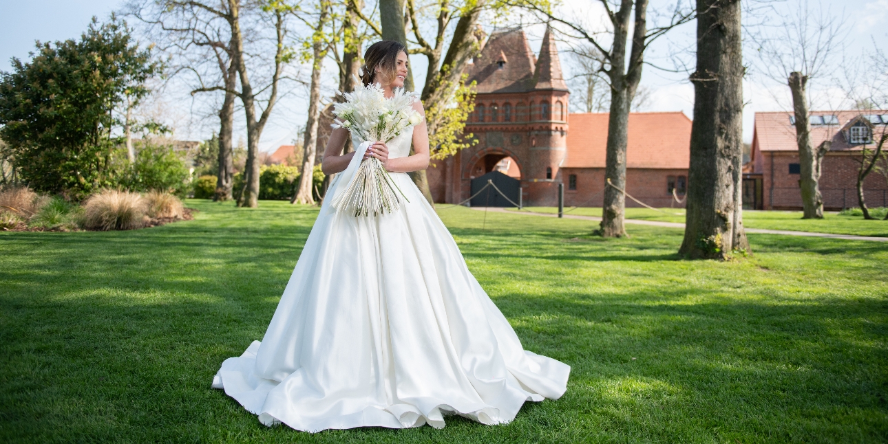 Bride standing in front of The Square wedding venue at Chester Zoo