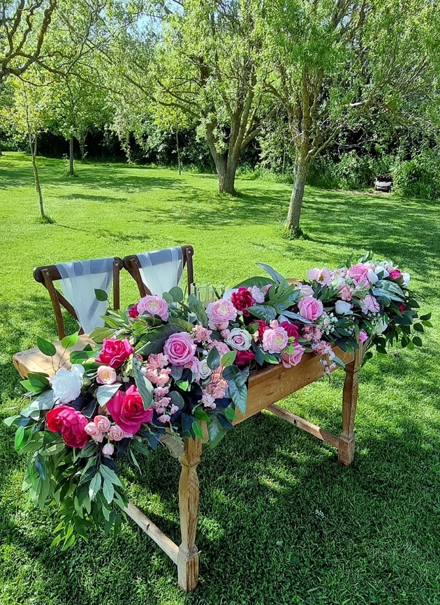 Viva Magenta registry signing table floral arrangement