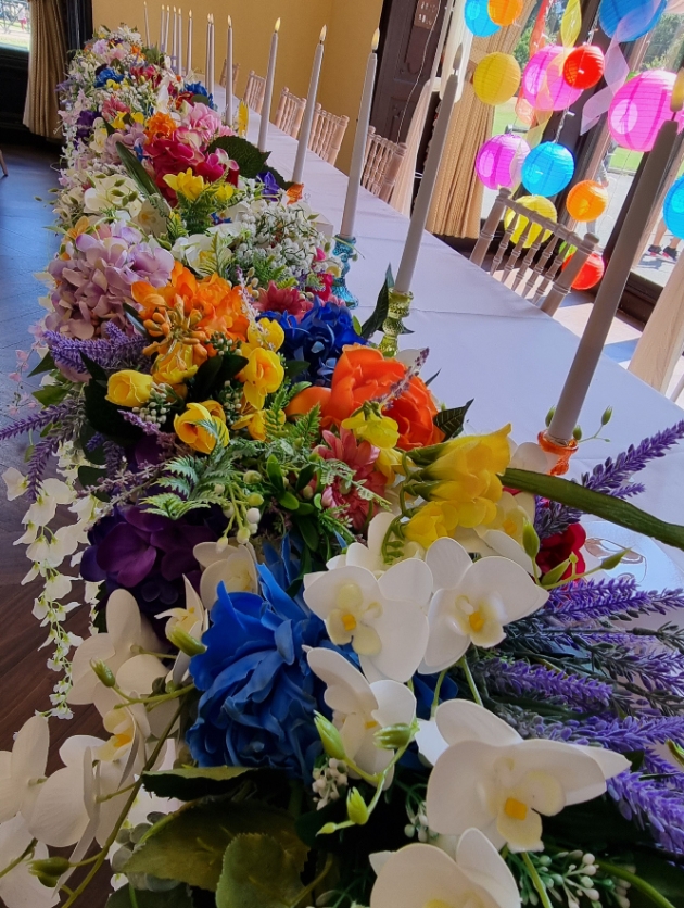 colourful festival vibe top table flower runner