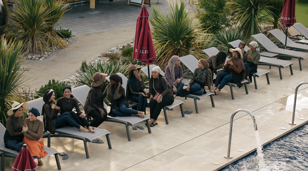 Women on sunloungers at the LYRA and Carden Park modest swimwear event