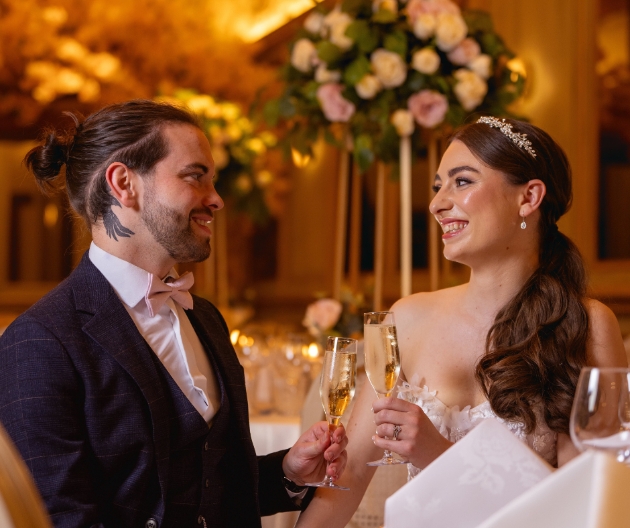 Bride and Groom toasting each other The Barn at The Manor Greasby