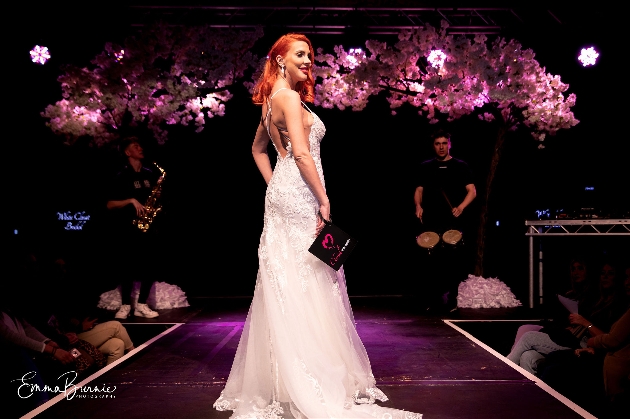 model in wedding dress on catwalk