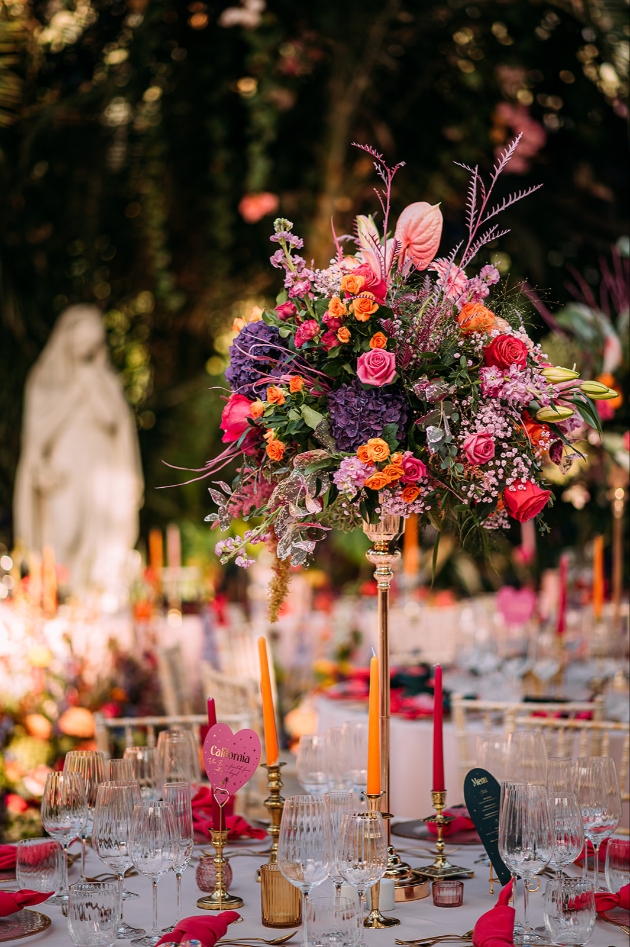High wedding centrepiece florals pink orange purple