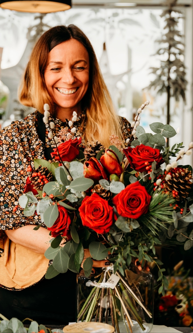 Rachel from La Beau Fleurs with red rose bouquet