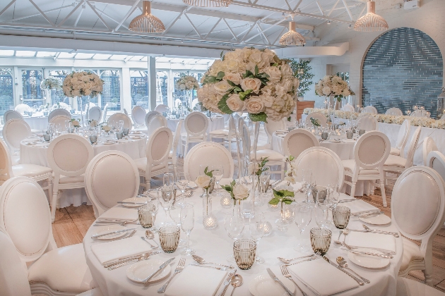 Cottons Hotel and Spa function room set up for a wedding reception all dressed in white