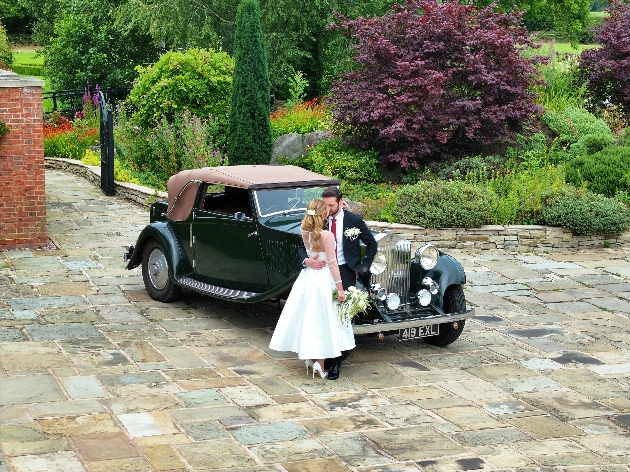 Fernside House - Bride and groom with their wedding car on the front drive