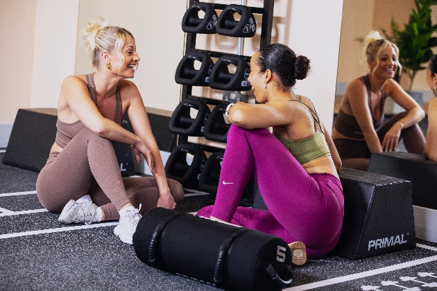 Two women chatting at the gym