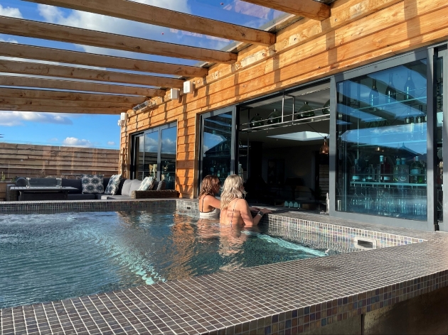 Two guests at swim up bar Manor House Alsager spa