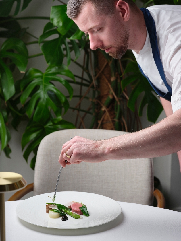Edward Marsh putting the final touches on a fine dining main course