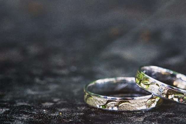 pattern engraved wedding rings with blue stone in white metal