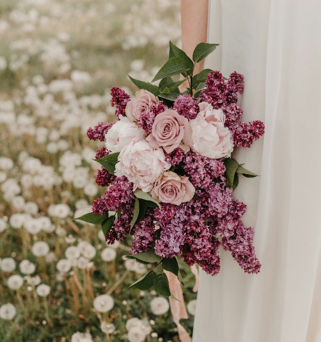 bridal bouquet with roses peonies and lilaces