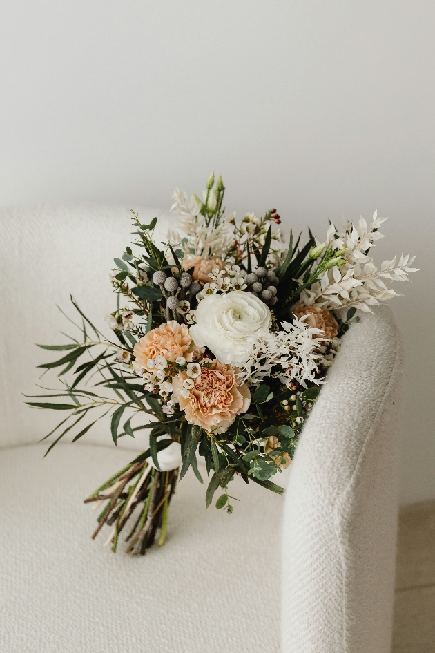 BOUQUET ON A WHITE ARM CHAIR PEACH