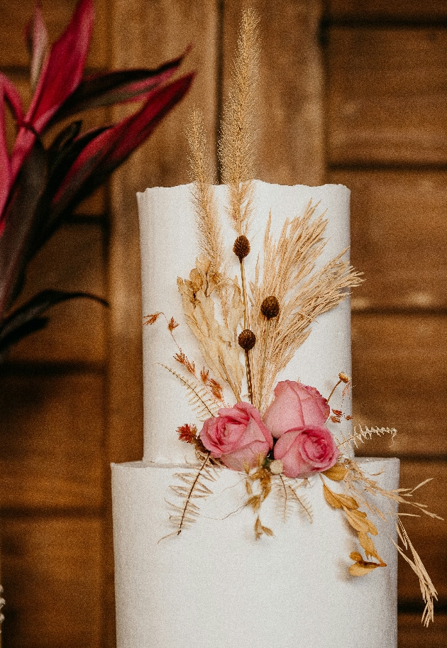 pampas grass decorating a wedding cake