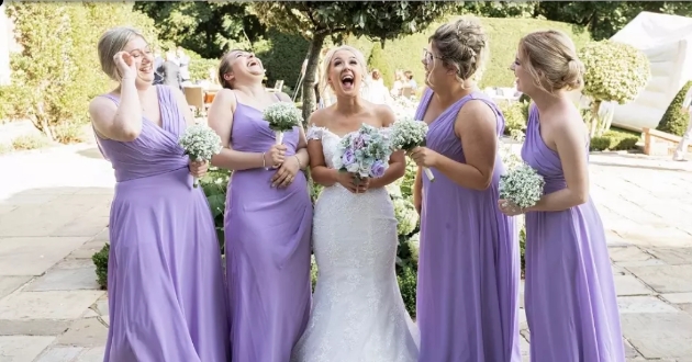 bridesmaids dressed in lilac with bride