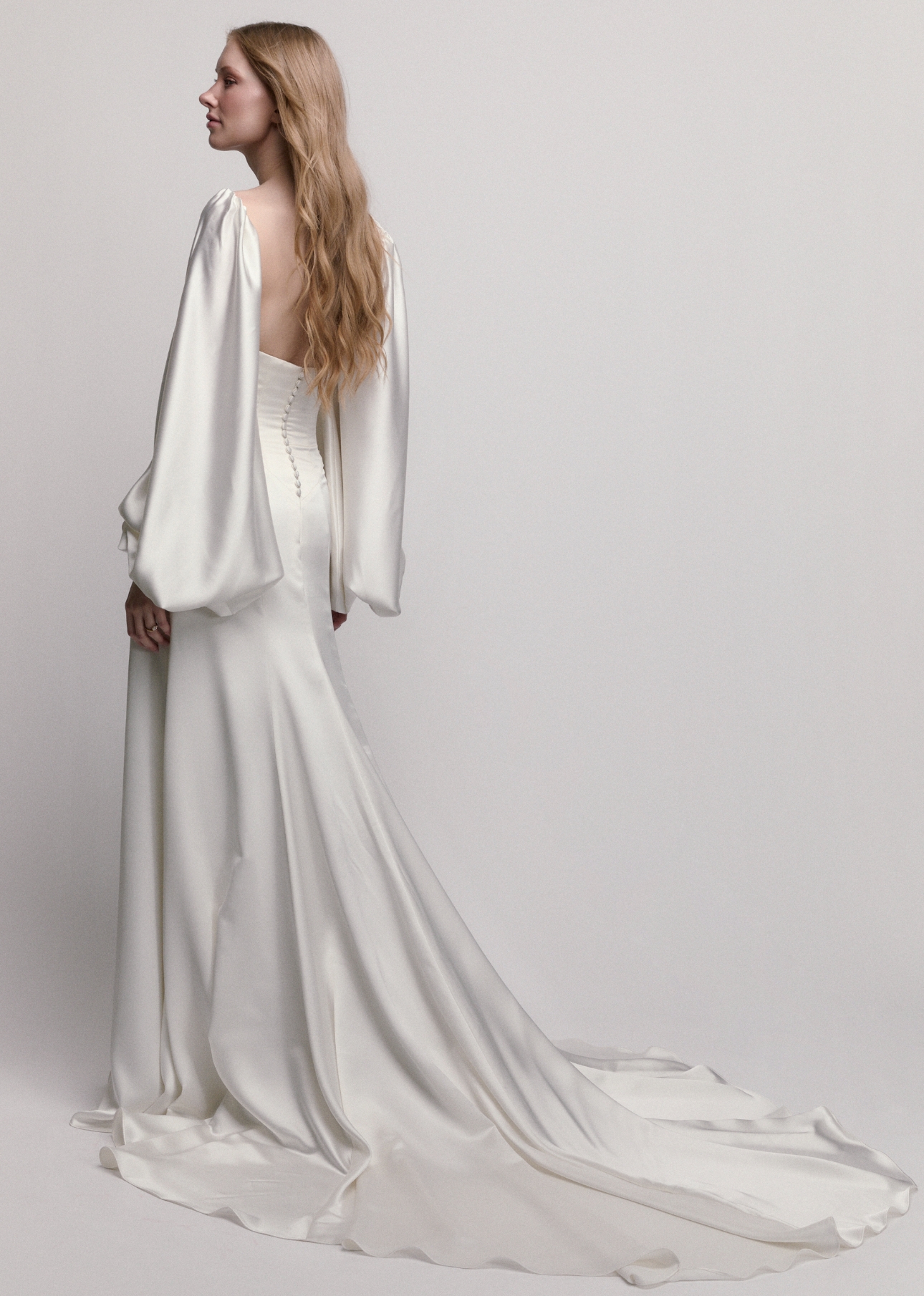 Audrey pairs a soft straight neckline with a sculpted drop waist and an airy A-line skirt in silken Charmeuse
