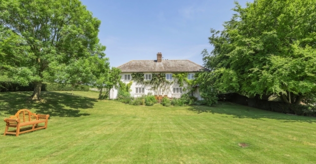 White picture postcard cottage